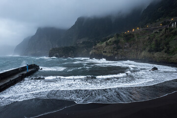 Aerial drone view  of the coast of Seixal at cloudy dramatic weather, Madeira, Portugal, Europe - 779410171