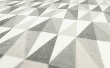 Grey and white abstract fabric background. Triangle shapes material.
