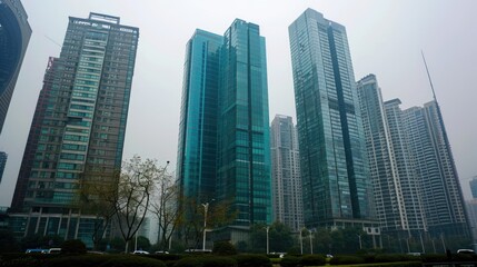 Fototapeta na wymiar Modern skyscrapers in a misty urban landscape.