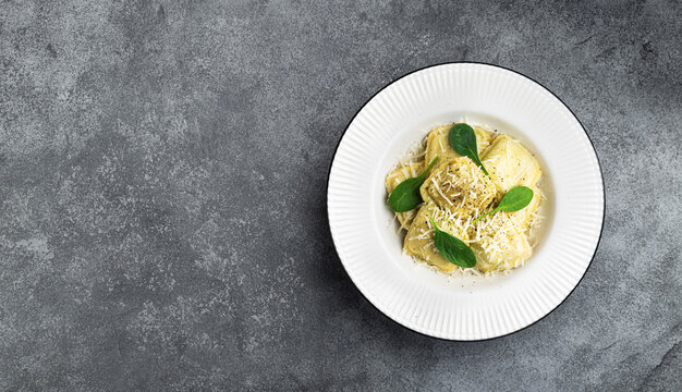 Ravioli with cheese and spinach, italian food, top view, copy space