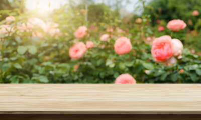 natural horizontal wood table background with flower garden behind