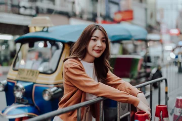 Foto op Canvas Young asian woman traveller. Beauty traveller female in city lifestyle chinatown street food market Bangkok, Thailand © Monster Ztudio