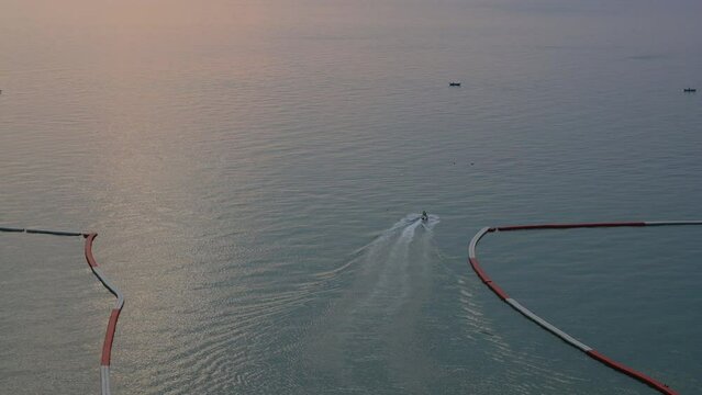 floating buoy barrier on sea, water wave in the evening