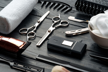 Professional Barber Tools Laid Out on Dark Wooden Surface
