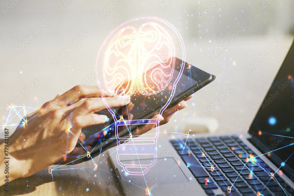 Leinwandbilder creative light bulb with human brain hologram and hand working with a digital tablet on background, 