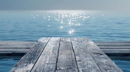 Wooden dock jutting out into a shimmering bay with a wooden platform background