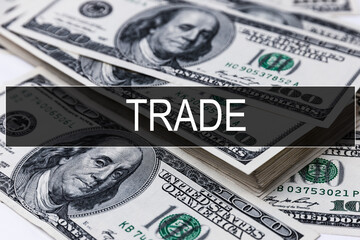 Text TRADE is written on the background of American banknotes. Business concept.