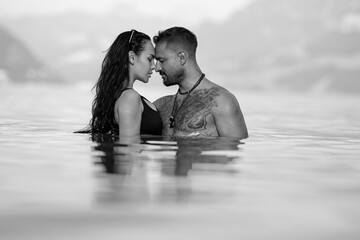 Sexy vacation. Sex on the beach. Summer sexy couples. Romantic couple in sea water. Sexy vacation. Sex on the beach. Erotic sensual couple kissing in the water. Summer sexy couples. Black and white.