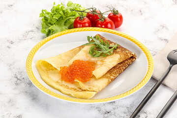 Russian pancake with red caviar