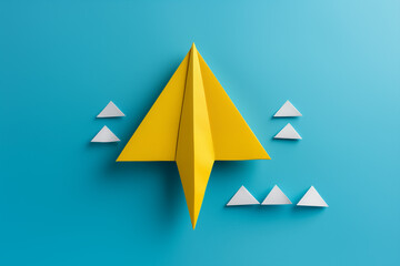 Origami yellow paper object on blue background.