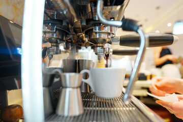 Preparing Espresso in a Modern Cafe During Busy Morning Hours