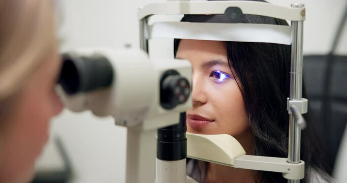 Asian woman, eye or slit lamp in glaucoma, exam or ophthalmology as visual, healthcare or treatment. Optometrist, patient or led light as medical technology to assess lens in specialist consultation