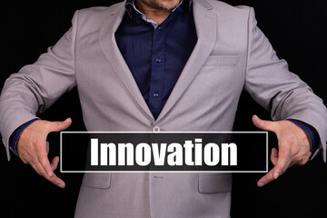 Innovation Concept. Man holding an icon with a message text written on it.