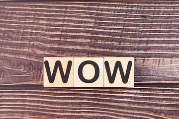 Word WOW is made of wooden building blocks. Concept.