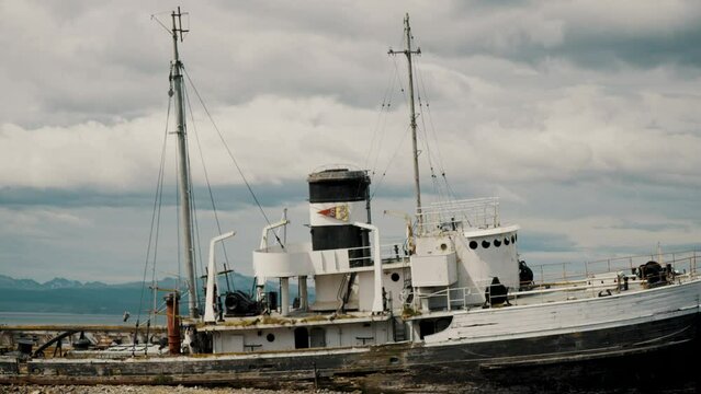 Dilapidated Abandoned Tugboat In Ushuaia Harbor, Tierra del Fuego, Argentina. Handheld Shot