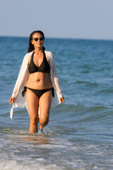 Woman body pretty with black  bikini on beach