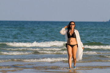 Woman body pretty with black  bikini on beach