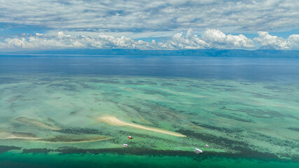 Top view of sandbar and coral reef in turquoise water. Negros, Philippines.