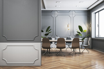 Bright classic meeting room interior with empty mock up place on wall, wooden flooring, furniture...