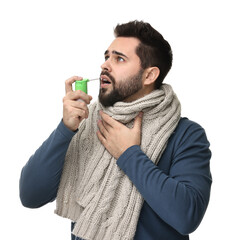 Young man with scarf using throat spray on white background