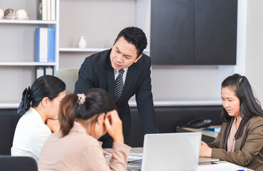 Serious meeting, managers with diverse coworkers team at meeting room. Group of coworkers in a conference room during the meeting