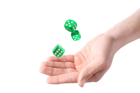 Man throwing green dice on white background, closeup