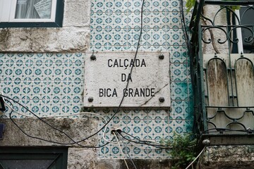 Historic Lisbon street plaque on the walls of a decorated residence in Bairro Alto, Lisbon, Portugal