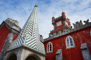 Colorful clocktower and archway of the Palace de Pena in Sintra, Portugal