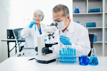 scientists conducting research investigations in a medical laboratory, a researcher in the...
