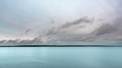 calm water landscape with sky with clouds - obrazy, fototapety, plakaty