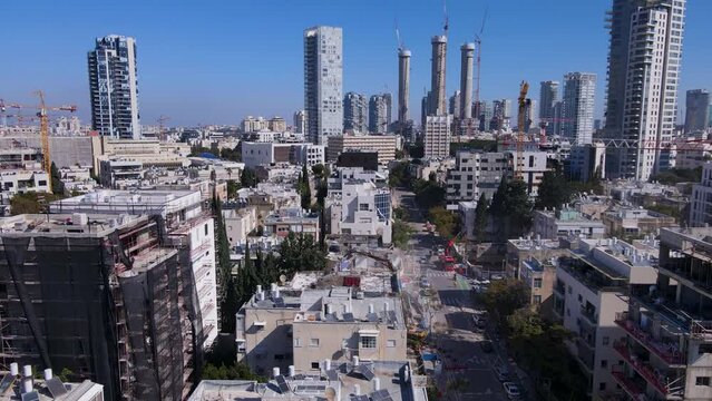 David Bloch Street in Tel Aviv Israel, aerial pullback ascend above construction