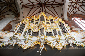 Ancient musical pipe organ in a gothic church	