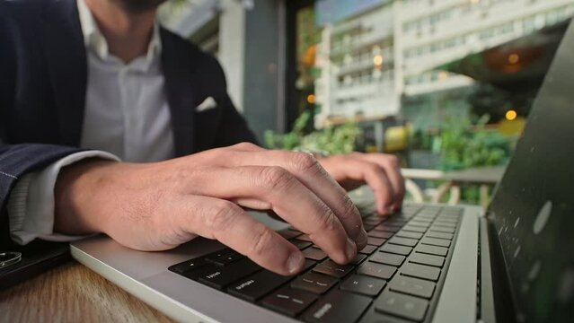 Handsome 30s top manager work laptop close up. Entrepreneur type computer macbook keyboard. Business man look monitor. Young male businessman. 40s employee create start up closeup. Ceo office boss job