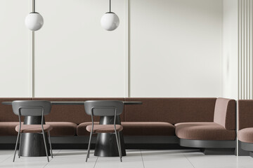 A modern cafe interior with stylish chairs, a long bench, pendant lamps, and a white wall, concept...
