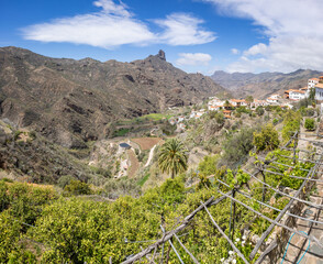 The old mountain village Tejeda in the center of the island Grand Canary with the peak Roque Bentayga in the background. Lemon trees in the foreground.