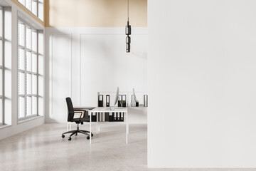 White coworking interior with office furniture and window. Mock up wall