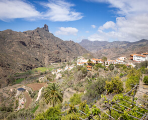The old mountain village Tejeda in the center of the island Grand Canary with the peak Roque Bentayga in the background. Lemon trees in the foreground.
