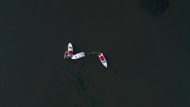 "Capture the breathtaking beauty of Lake Baikal and the Angara River from above in stunning aerial footage. Ships and boats glide through the crystal-clear waters, offering fantastic views.