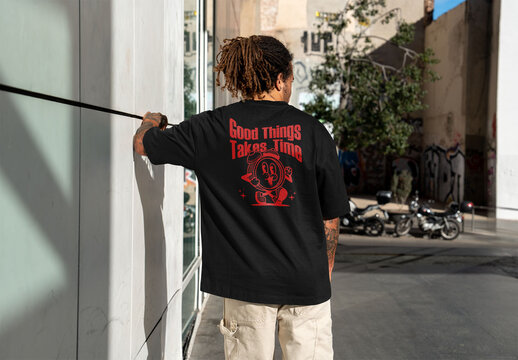 Mockup of man in customized t-shirt, rear view