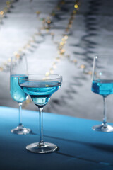 Glasses with blue alcohol cocktail ready for a party