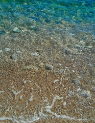 Beach. Crystal clear sea water and sand.