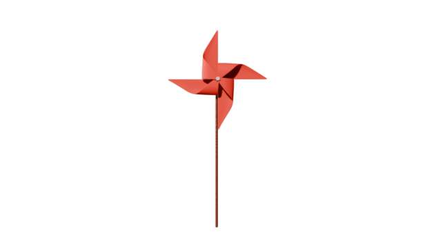 a red pinwheel on a stick in the dark