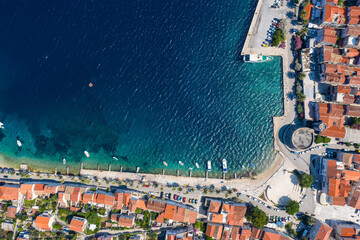Korcula, Croatia: Top down drone view of the famous Korcula old town and pier by the Adriatic sea...