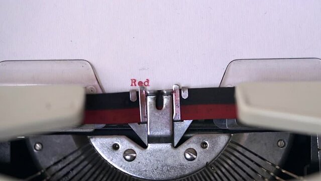 Red Alert written by a typewriter on white paper