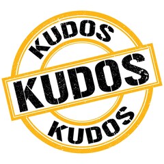 KUDOS text on yellow-black round stamp sign