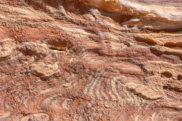 Sandstone rock and mineral layers in Petra, Jordan