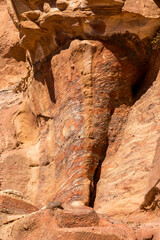 Sandstone rock and mineral layers in Petra, Jordan