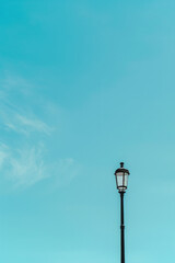 Fototapeta na wymiar Isolated lamppost against blue sky