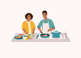 Black Couple Preparing Food Together In The Kitchen. Smiling Black Wife Cutting Cucumber With Knife. Husband In Apron Cooking Steak With Frying Pan. Half Length.