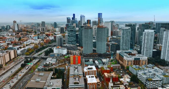 Downtown of Seattle, Washington, USA at daytime. Drone approaching the high-rise buildings in a big city.